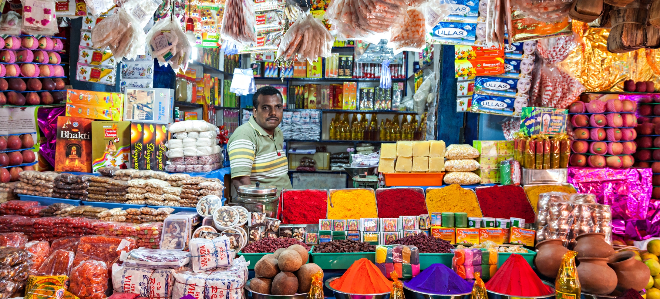 merchant standing in his shop
